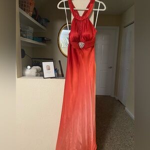 Elegant Red Halter Evening Gown with Brooch Accent